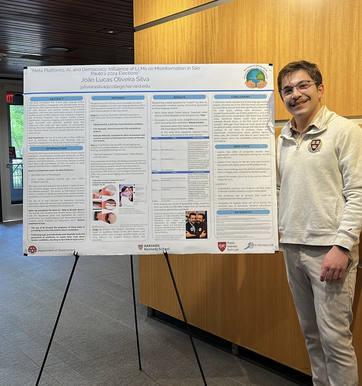 João Lucas Oliveira Silva beside his research poster on LLMs and misinformation in São Paulo's 2024 elections